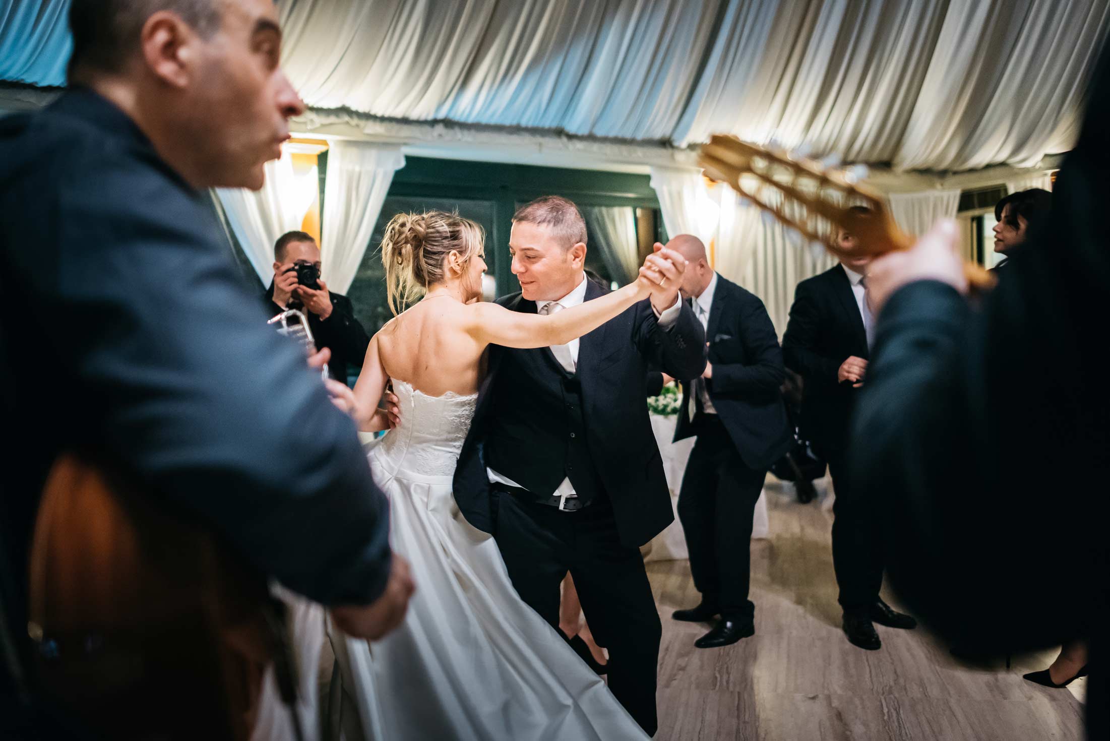 Newlyweds dancing during a wedding in Italy