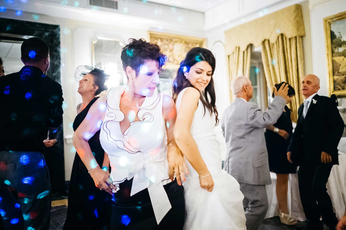 Mother dancing with the bride during a wedding in Italy
