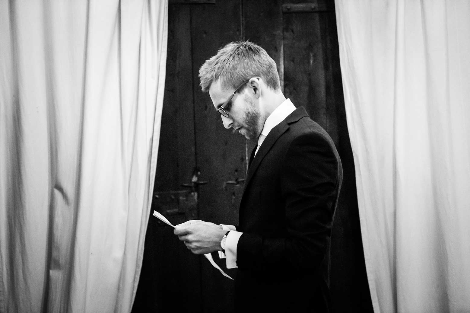 Groom reading his speech, picture shot in documentary wedding photography style